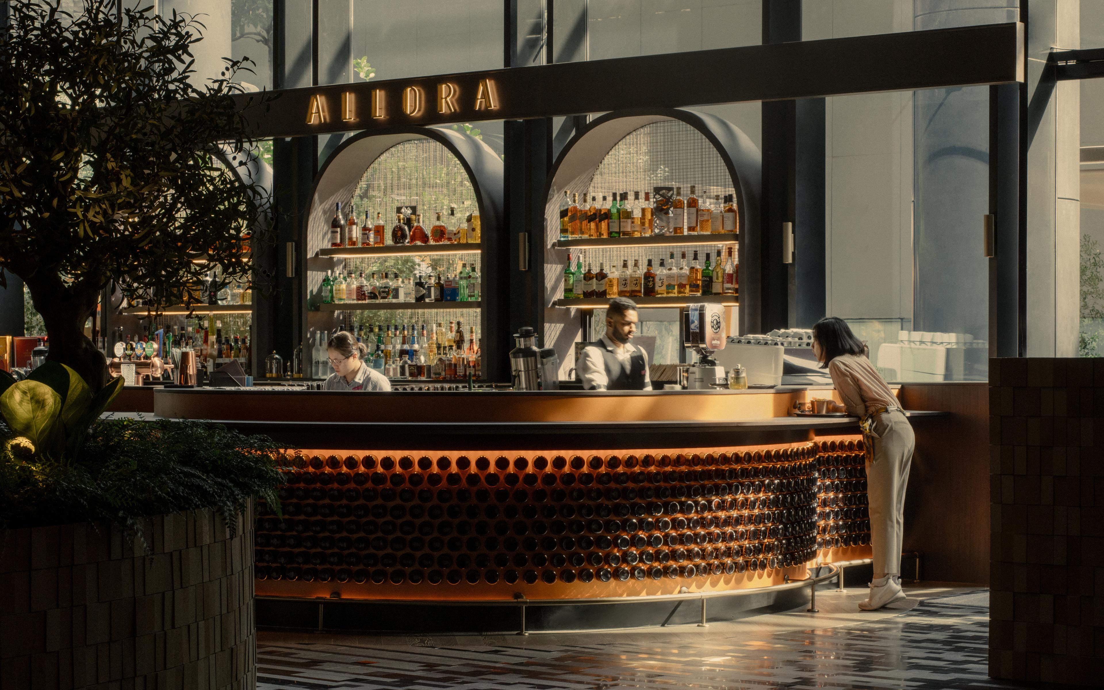 A bar counter finished with recycled beer bottles collected from hawker centres